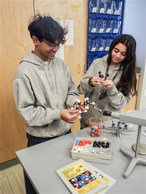two students with molecule