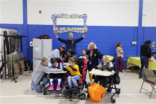 Bleshman Appreciation Event student and staff group photo with Thank you sign