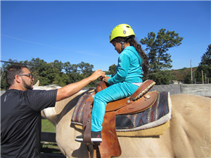 photo of student on a horse 