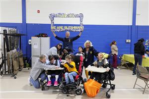Bleshman Appreciation Event student and staff group photo with Thank You sign